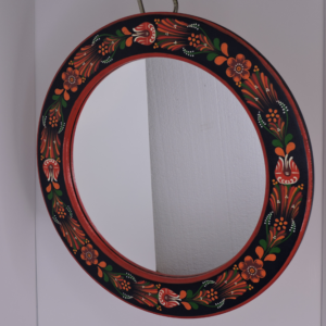 Hand-painted vintage Hungarian folk art round wall mirror from Transylvania, featuring colorful floral motifs on a dark circular frame