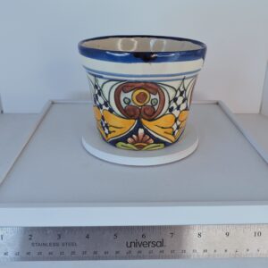 Hand-painted Talavera style Mexican pottery planter by Balleza with colorful floral design.