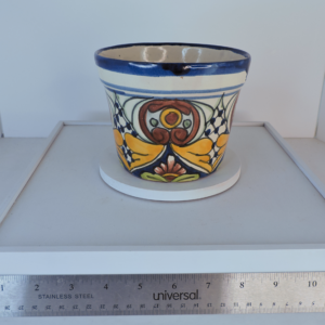 Hand-painted Talavera style Mexican pottery planter by Balleza with colorful floral design.
