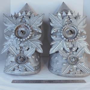 Pair of large 18.5 inch vintage Mexican hand-stamped tin architectural column finials with Aztec Revival details.